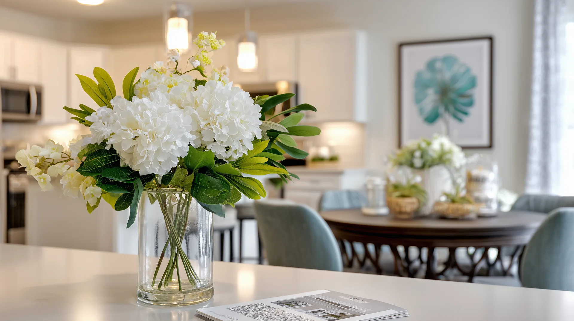White hydrangeas on countertop in a staged model home dining area