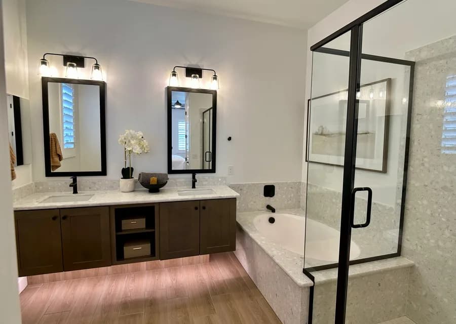 Model home bathroom with soaking tub and glass shower